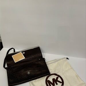 Michael Kors purse w/ protective bag.